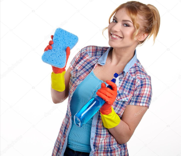 Woman holding a blue sponge and a spray bottle while wearing orange gloves and a plaid shirt.